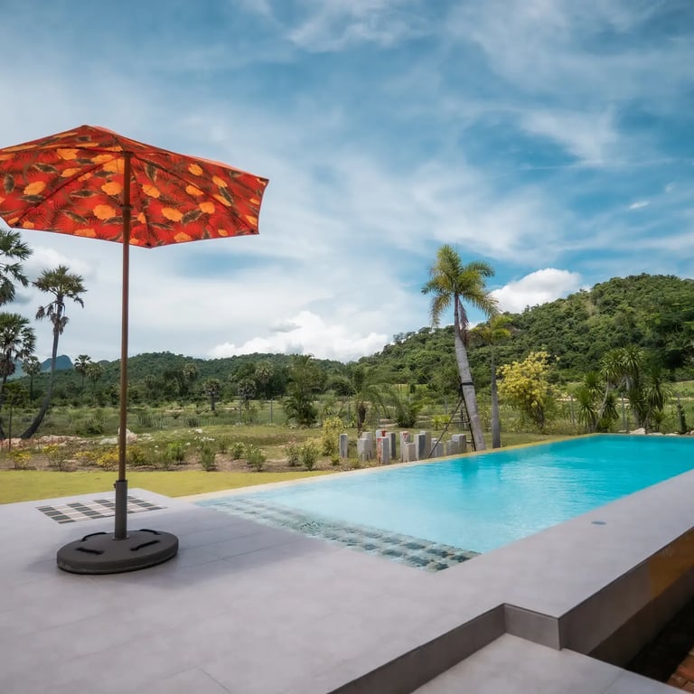 The pool at Baan Mahasamut Pranburi overlooking the mountain